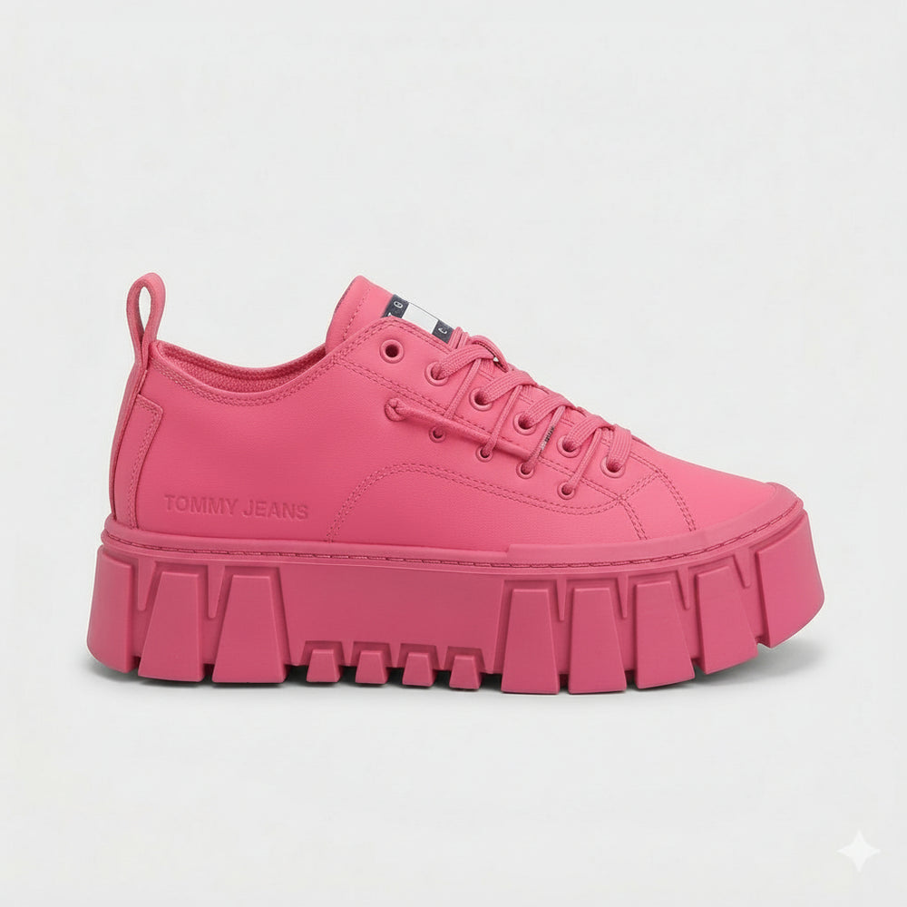 Pink sneaker with a thick sole on a light gray background